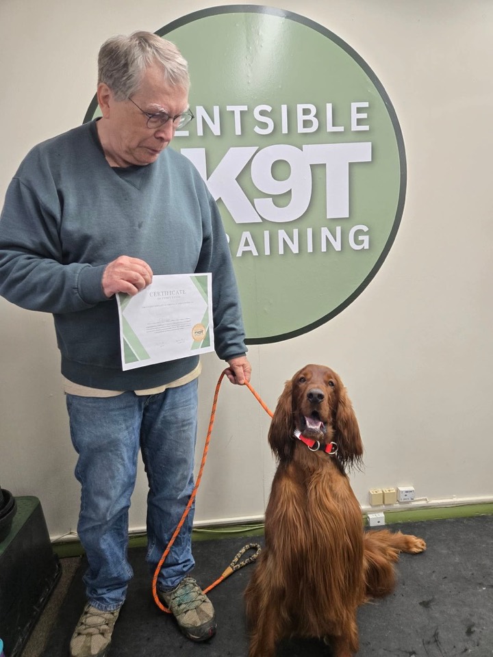 A dog and owner on graduation day at Scentsible K9 Training